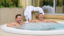 Two guests enjoy the bubble pool on the spa terrace at Heythrop Park