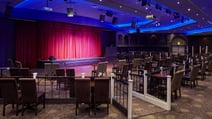 The Late Lounge, featuring a curtained stage, at Thoresby Hall Hotel