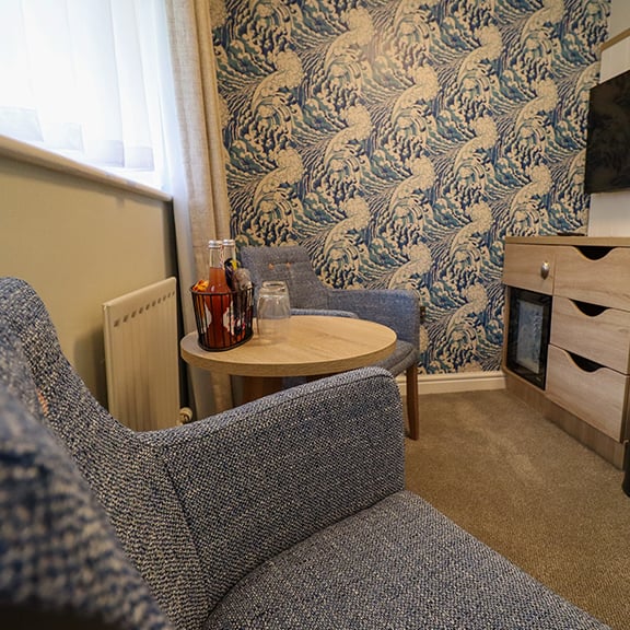 A refurbished bedroom seating area at Norton Grange